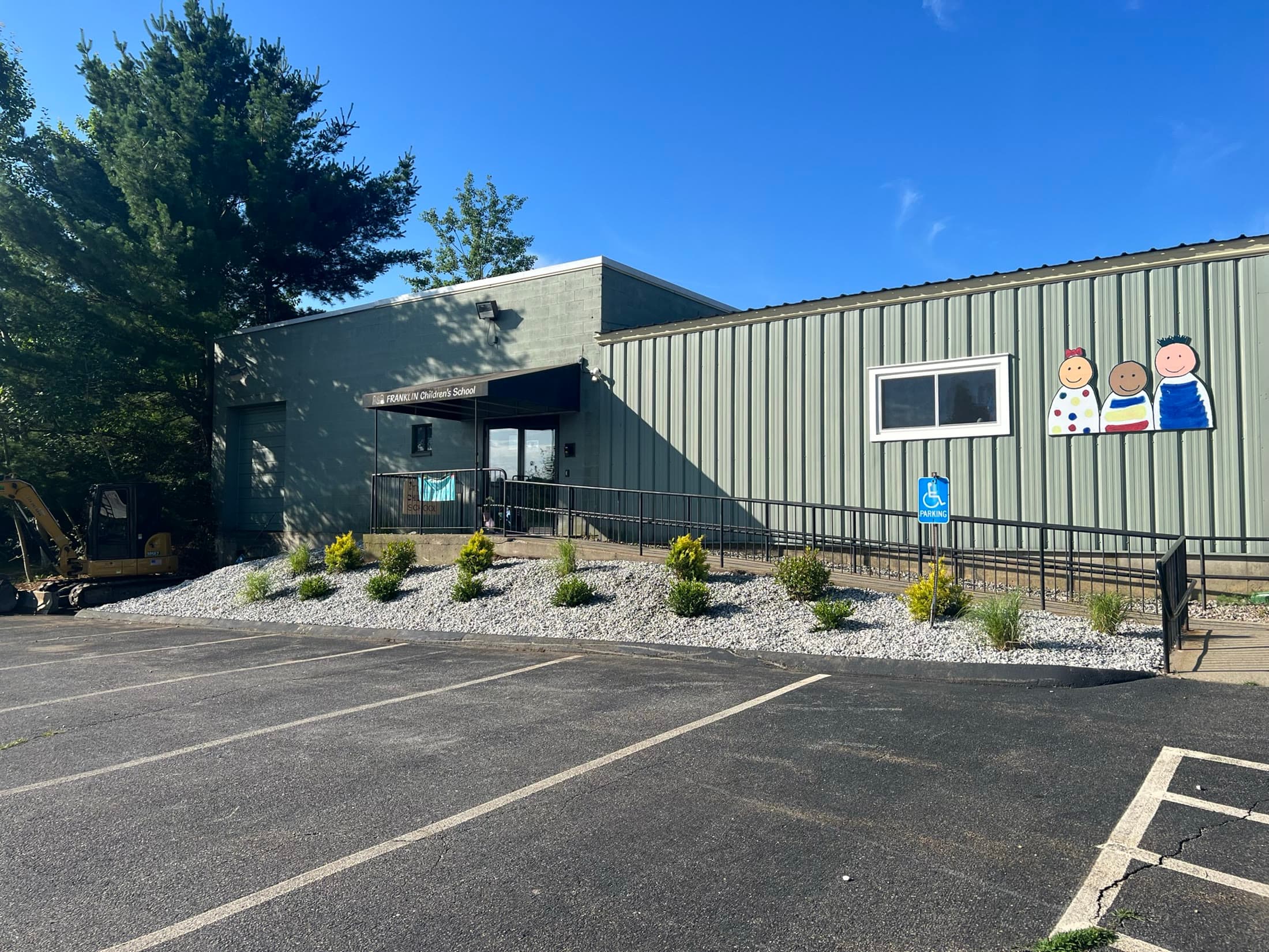 Completed commercial building landscape with lawn and layered plantings