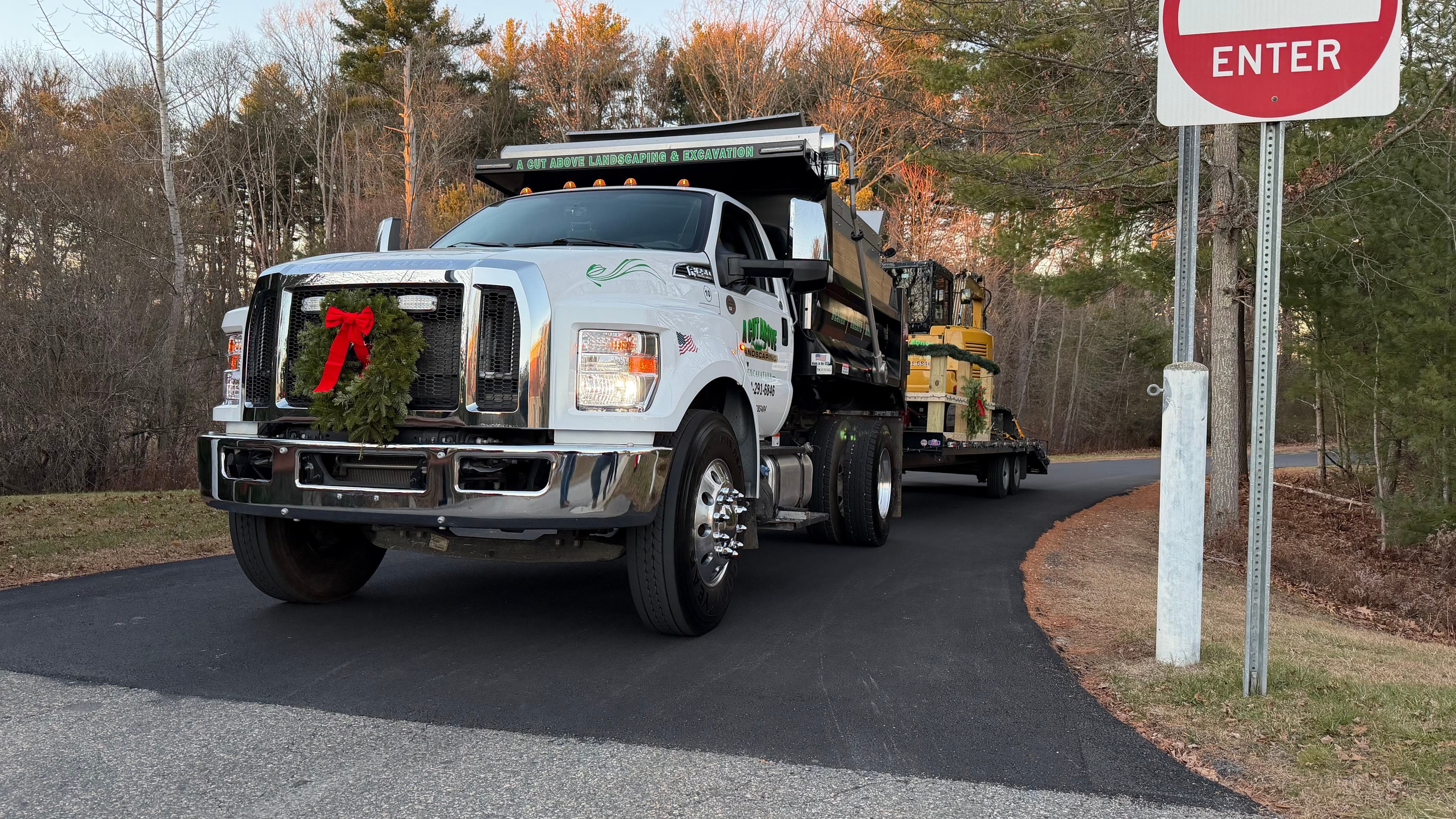 A Cut Above dump truck decorated with a Christmas wreath for the Bellingham and Medway Christmas parades