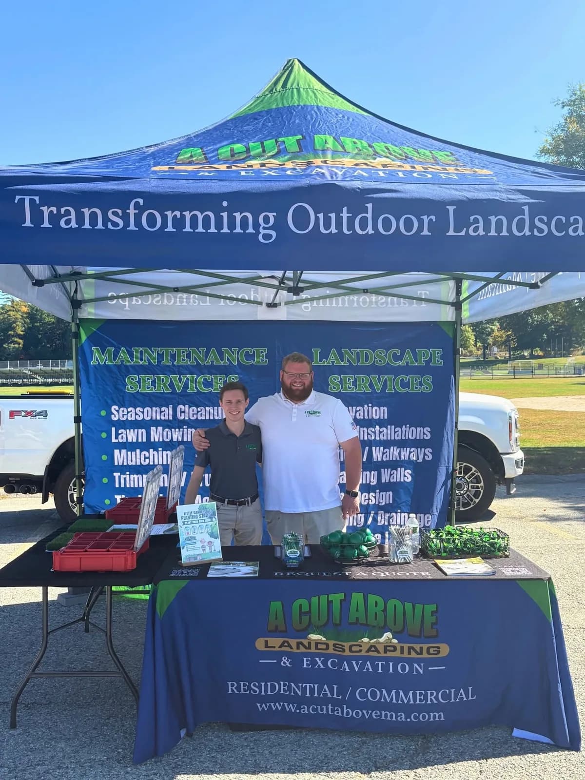 A Cut Above's booth and planting supplies at The Morgan Mission Touch-a-Truck