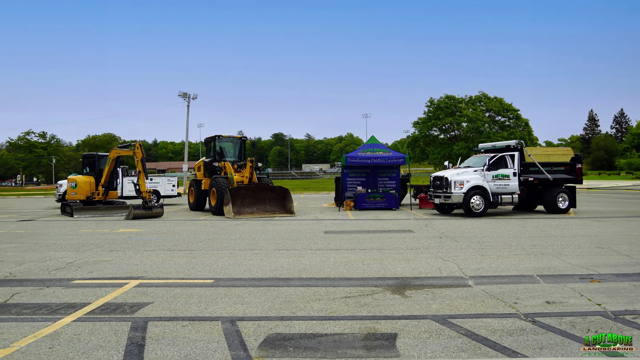 A Cut Above trucks and equipment arranged for a community Touch-a-Truck event