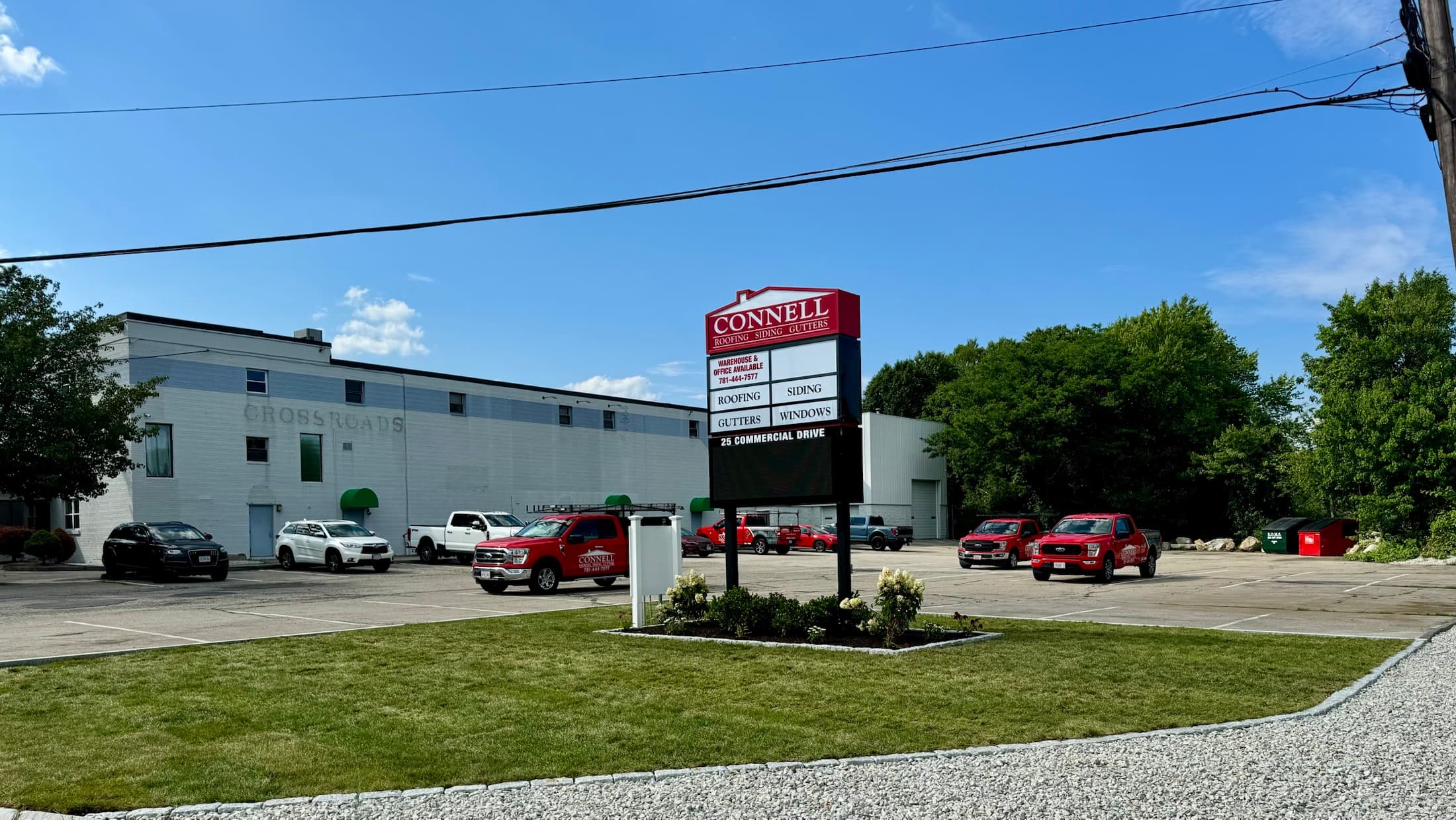 Connell Roofing commercial property with maintained lawn, planting beds, parking, and business access